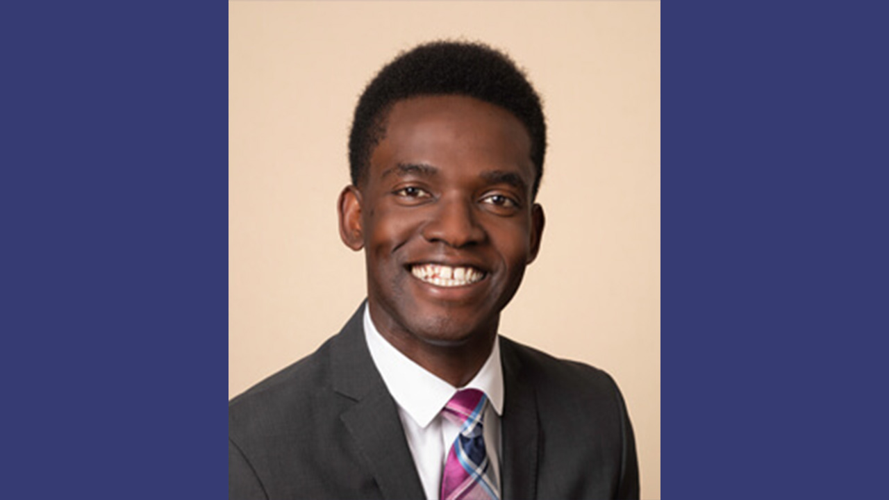 Dr. John Peters smiling at the camera