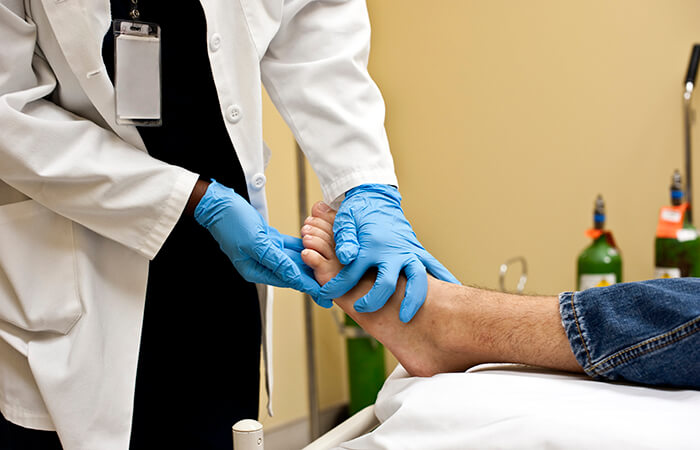 Doctor examining a person's foot