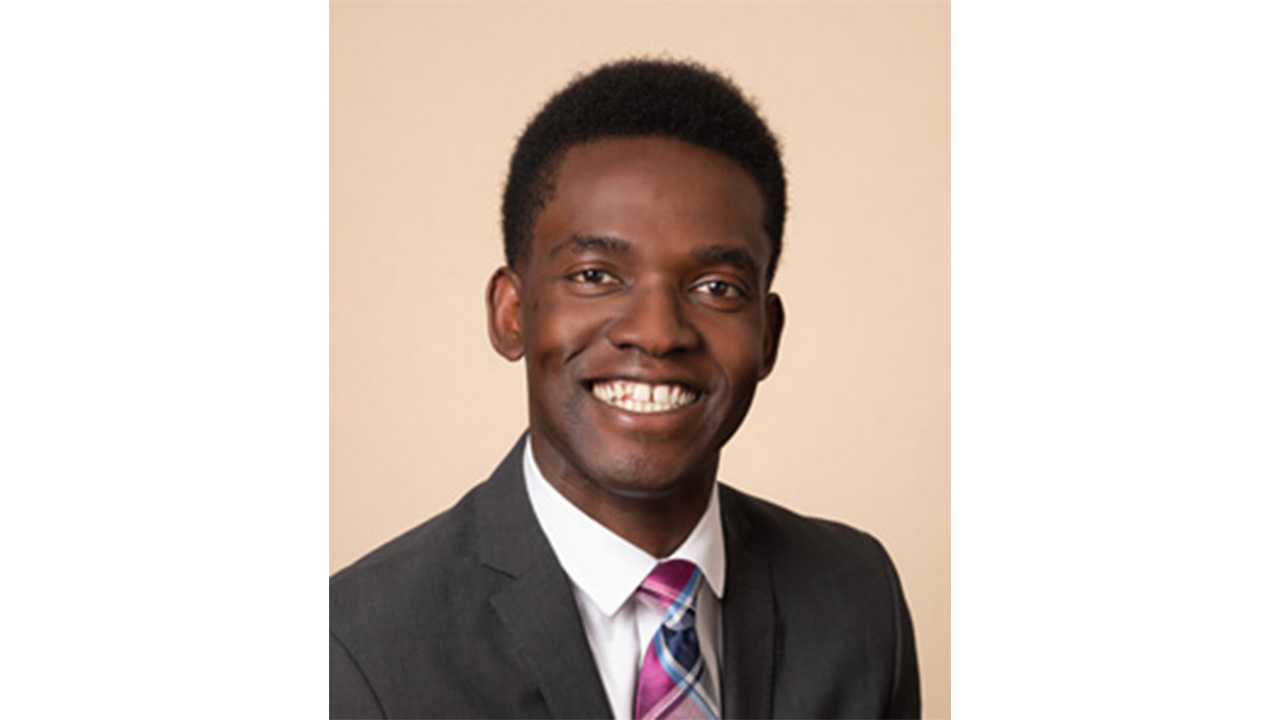 Dr. John Peters smiling at the camera