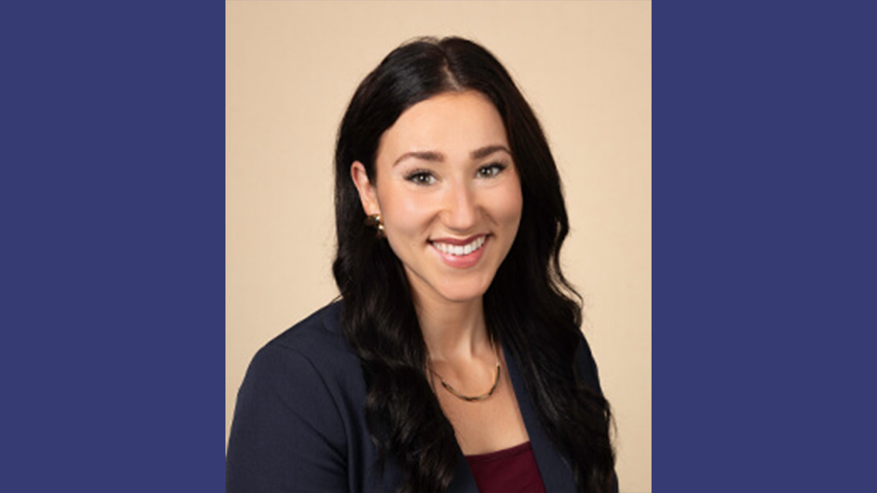 Dr. Rentmeester smiling at the camera