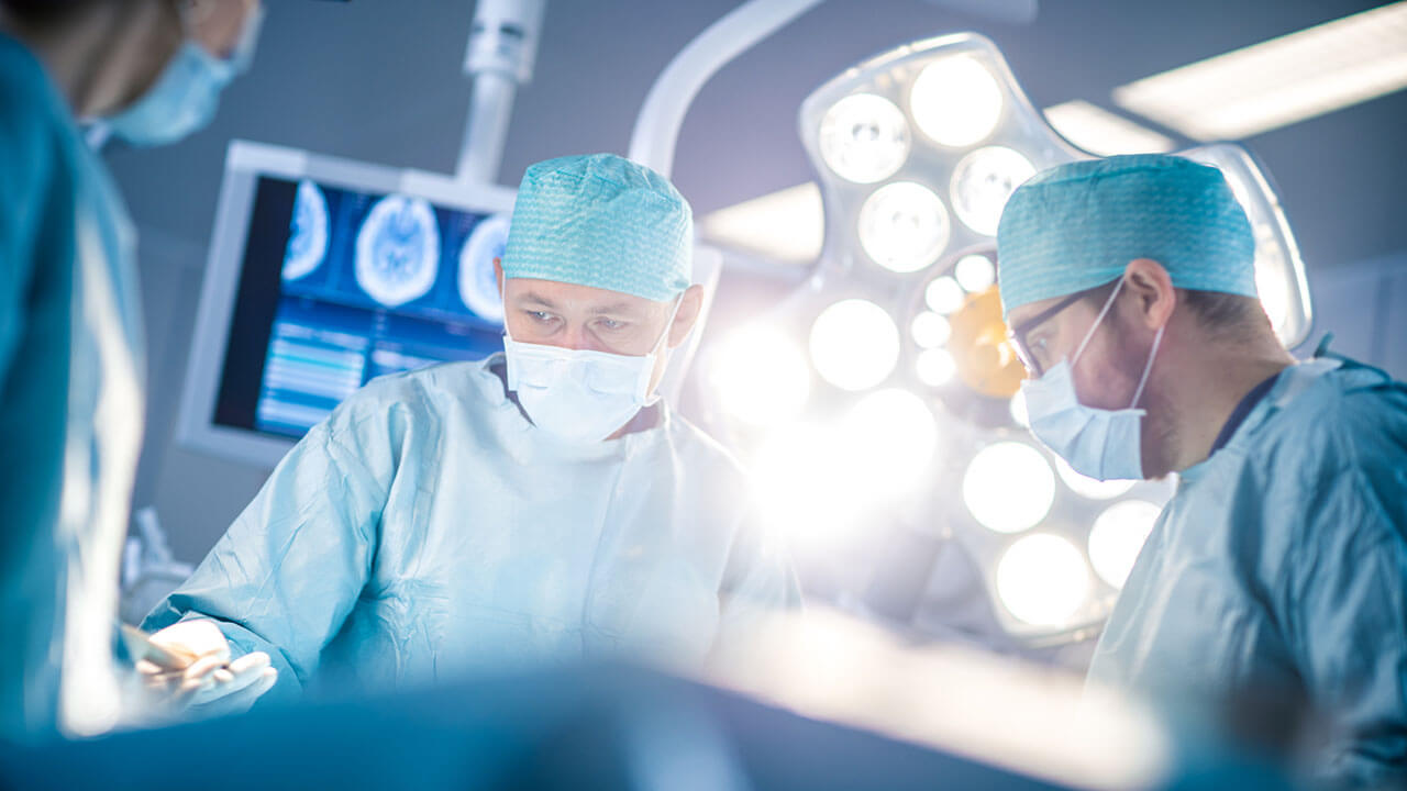 Two surgeons operating in an operating room