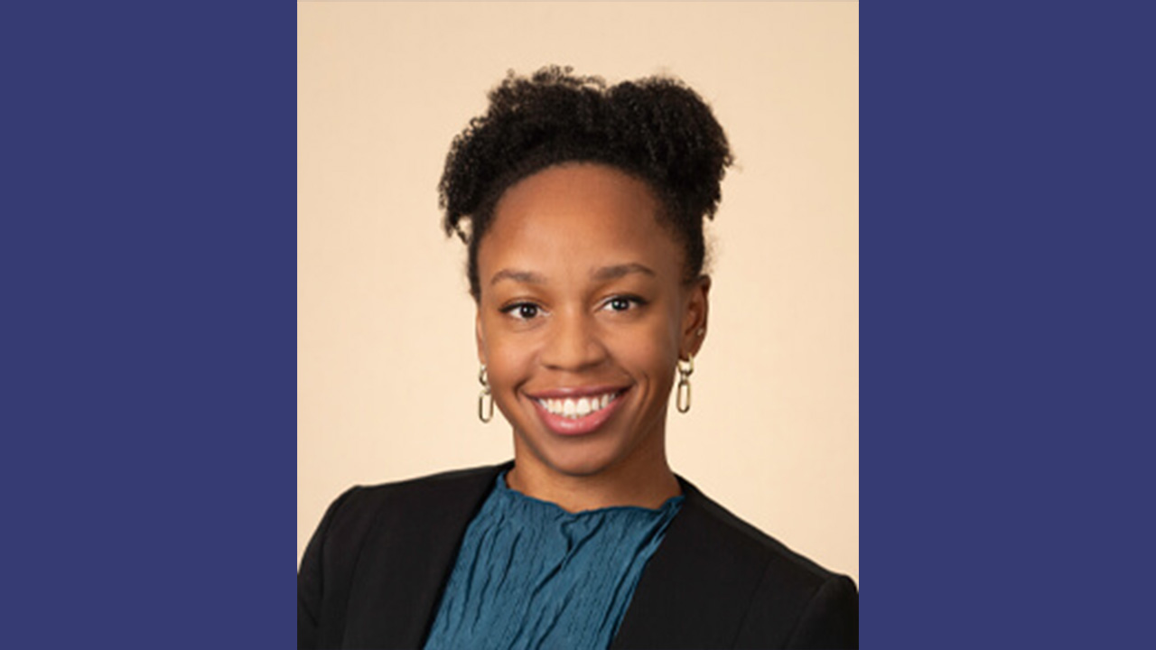 Dr. Rose smiling at the camera