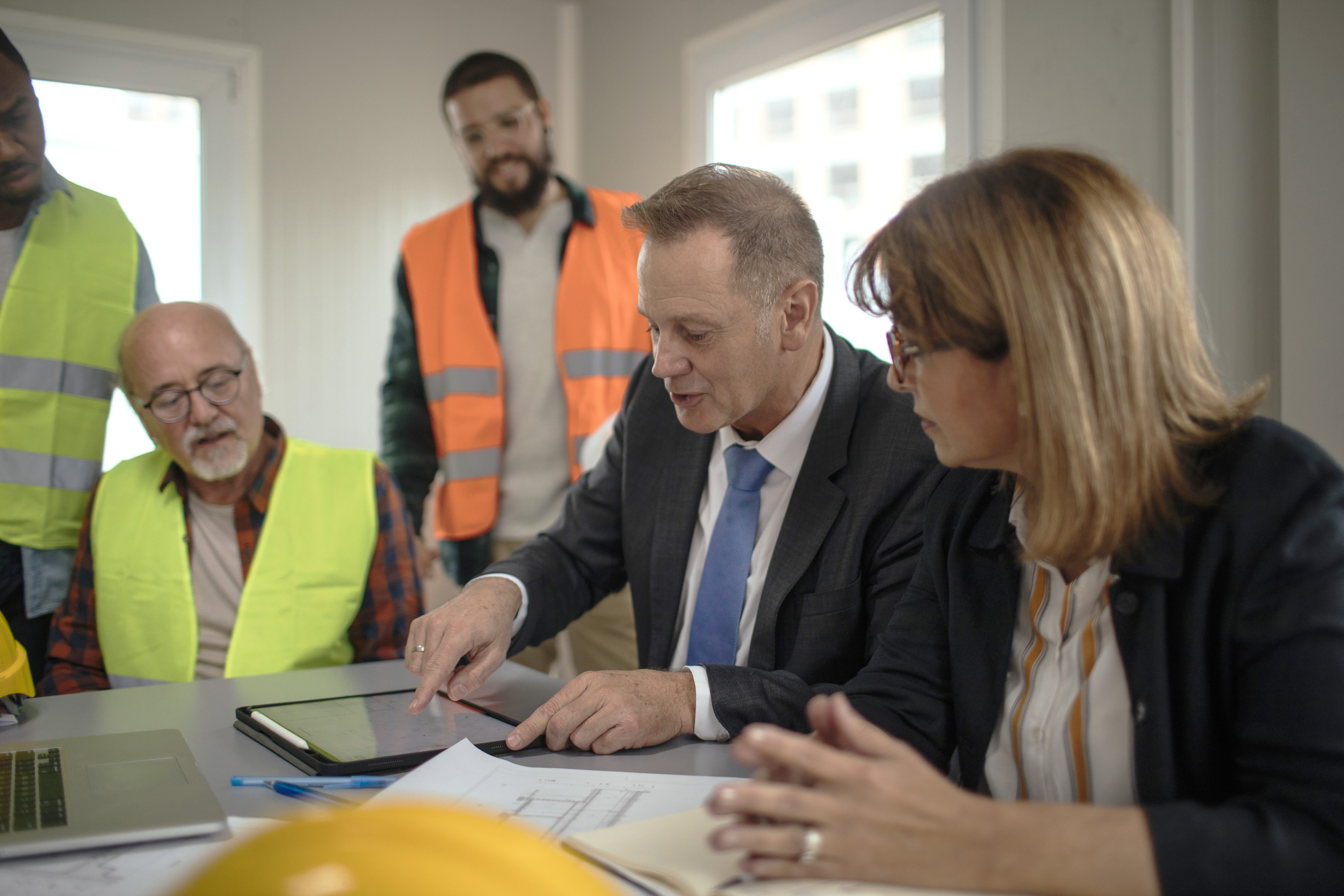 boss at table with employees