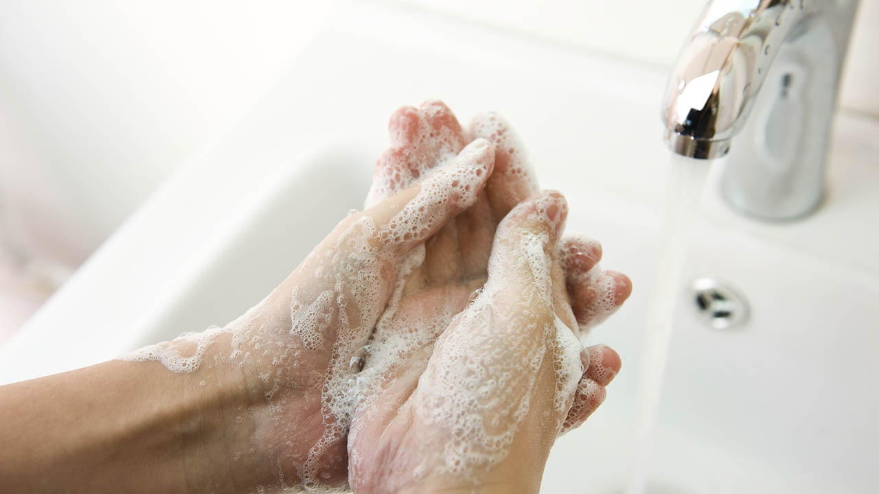Washing hands in sink