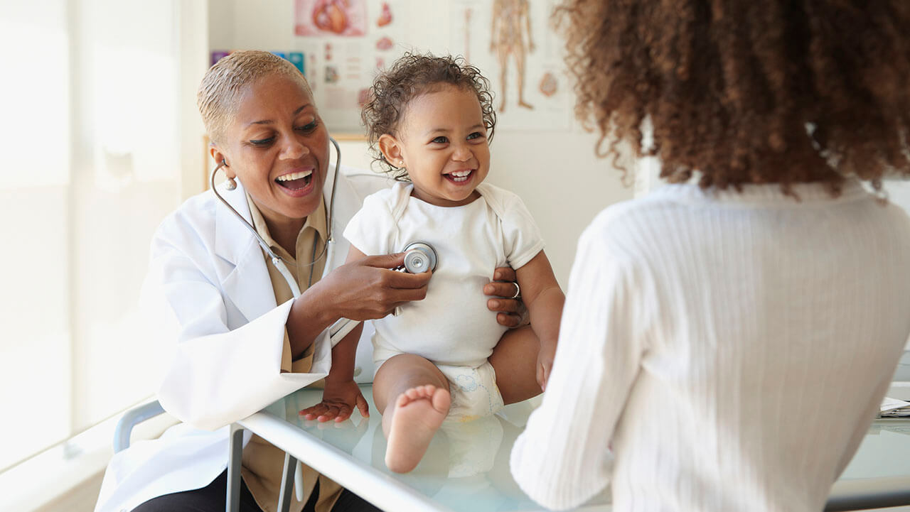 Doctor listening to a toddler's heartbeat with a stethoscope