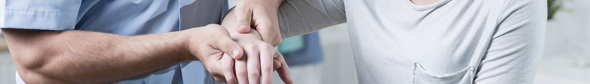 Provider Examining Patient's Wrist