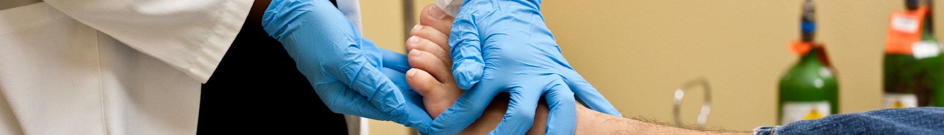 Doctor Examining Patient's Foot