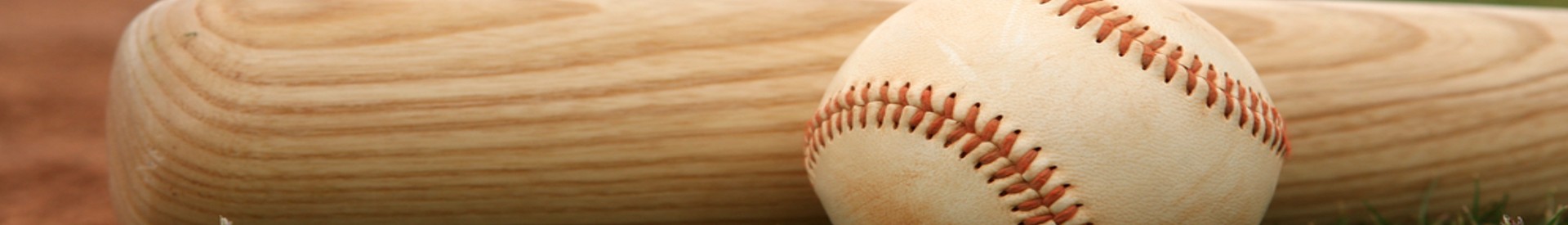 Baseball bat and glove on field